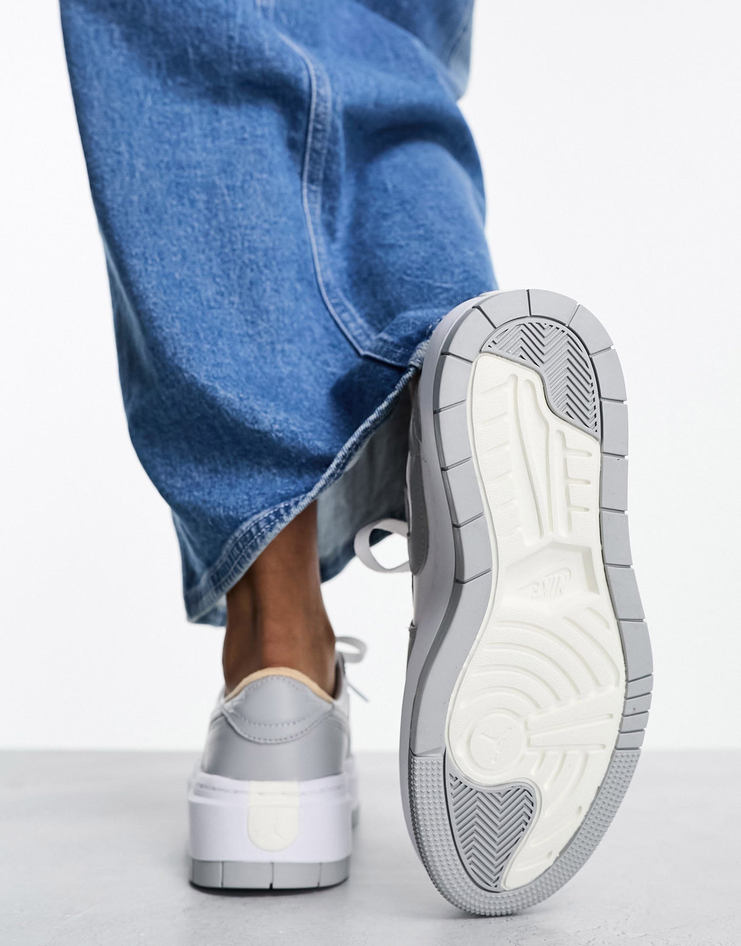 Jordan AJ1 Elevate Low trainers in white and grey