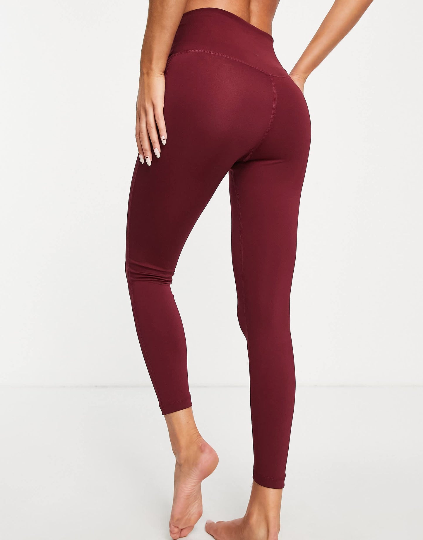 Nike Yoga Dri-FIT lurex tape 7/8 high-waisted leggings in burgundy
