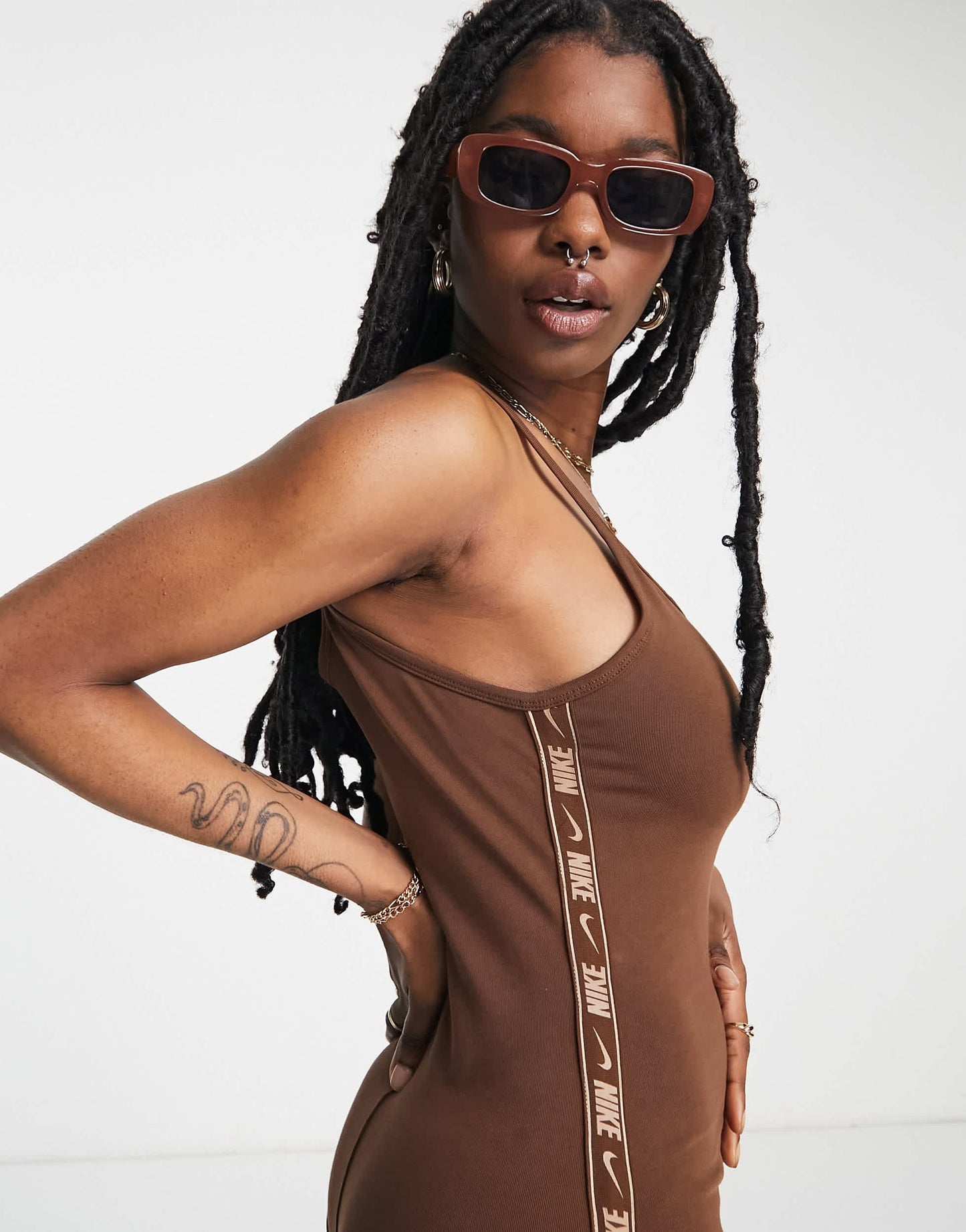 Nike swoosh tape unitard in cacao brown