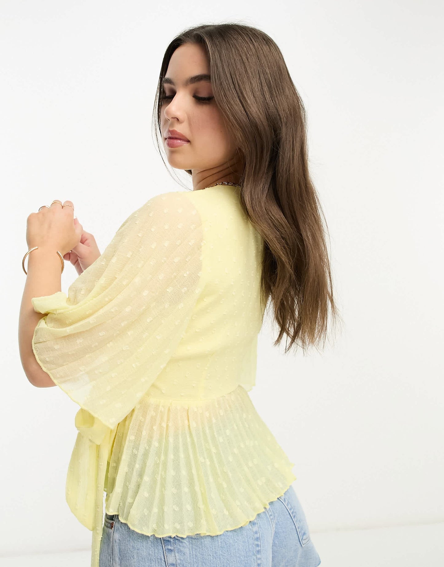 ASOS DESIGN Petite dobby wrap short sleeve blouse with pleated peplum hem in lemon