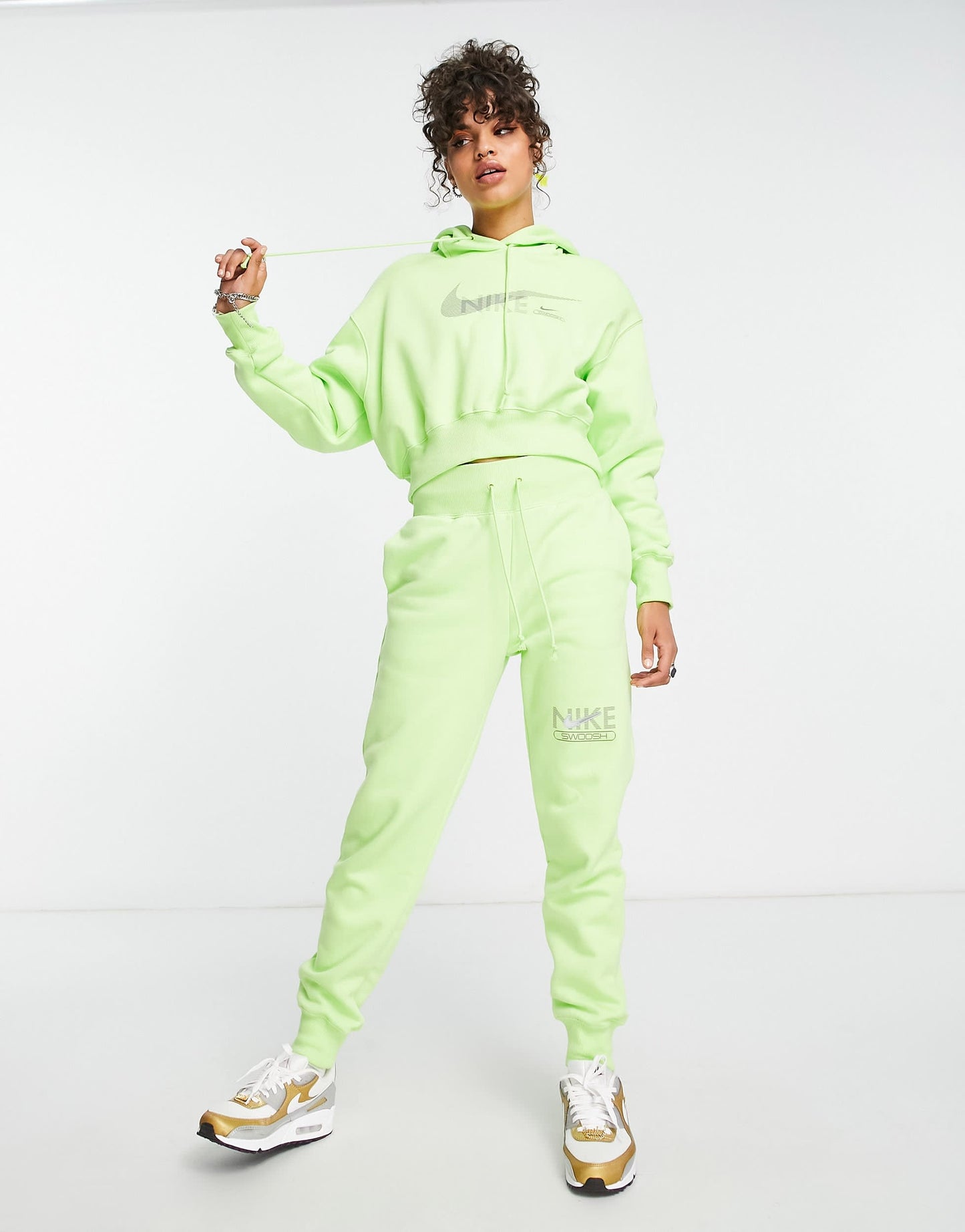 Nike Swoosh graphic cropped pullover hoodie in lime green