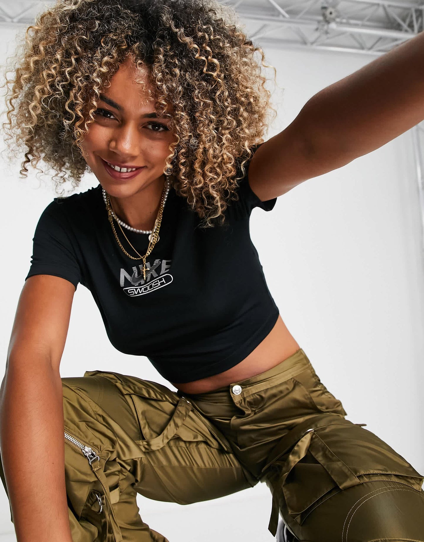 Nike Swoosh graphic slim crop t-shirt in black