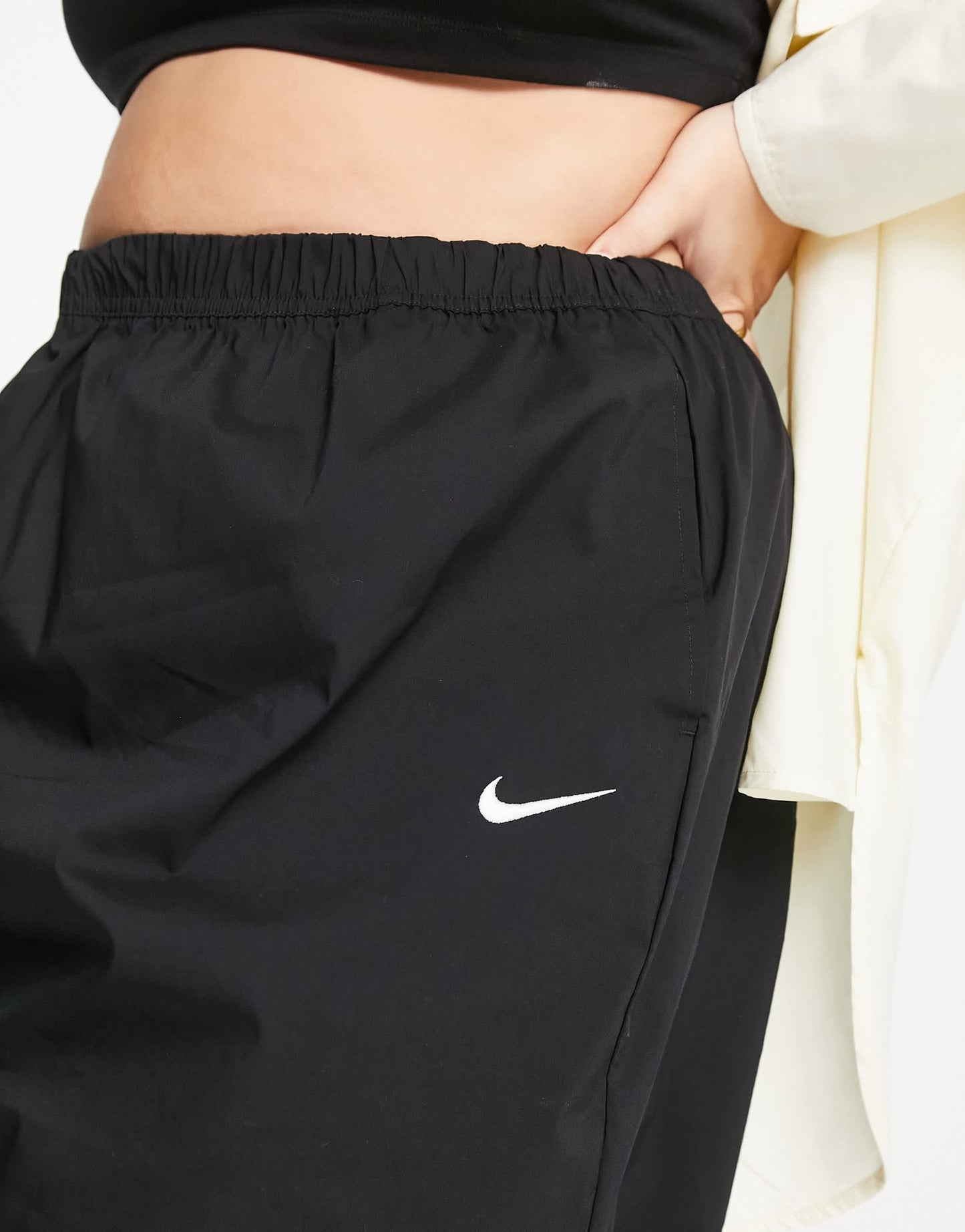 Nike Plus Essential woven high waisted skirt in black