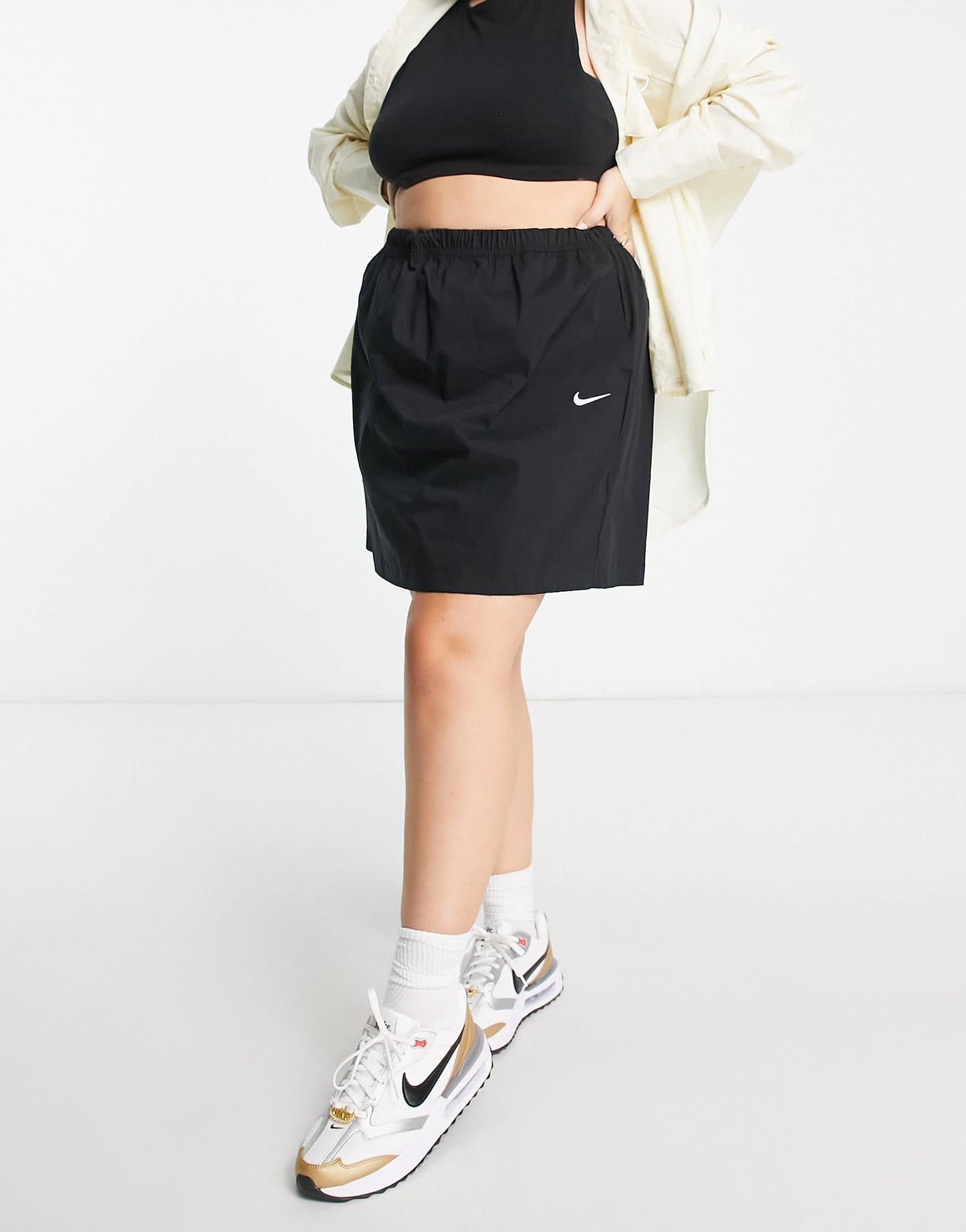 Nike Plus Essential woven high waisted skirt in black