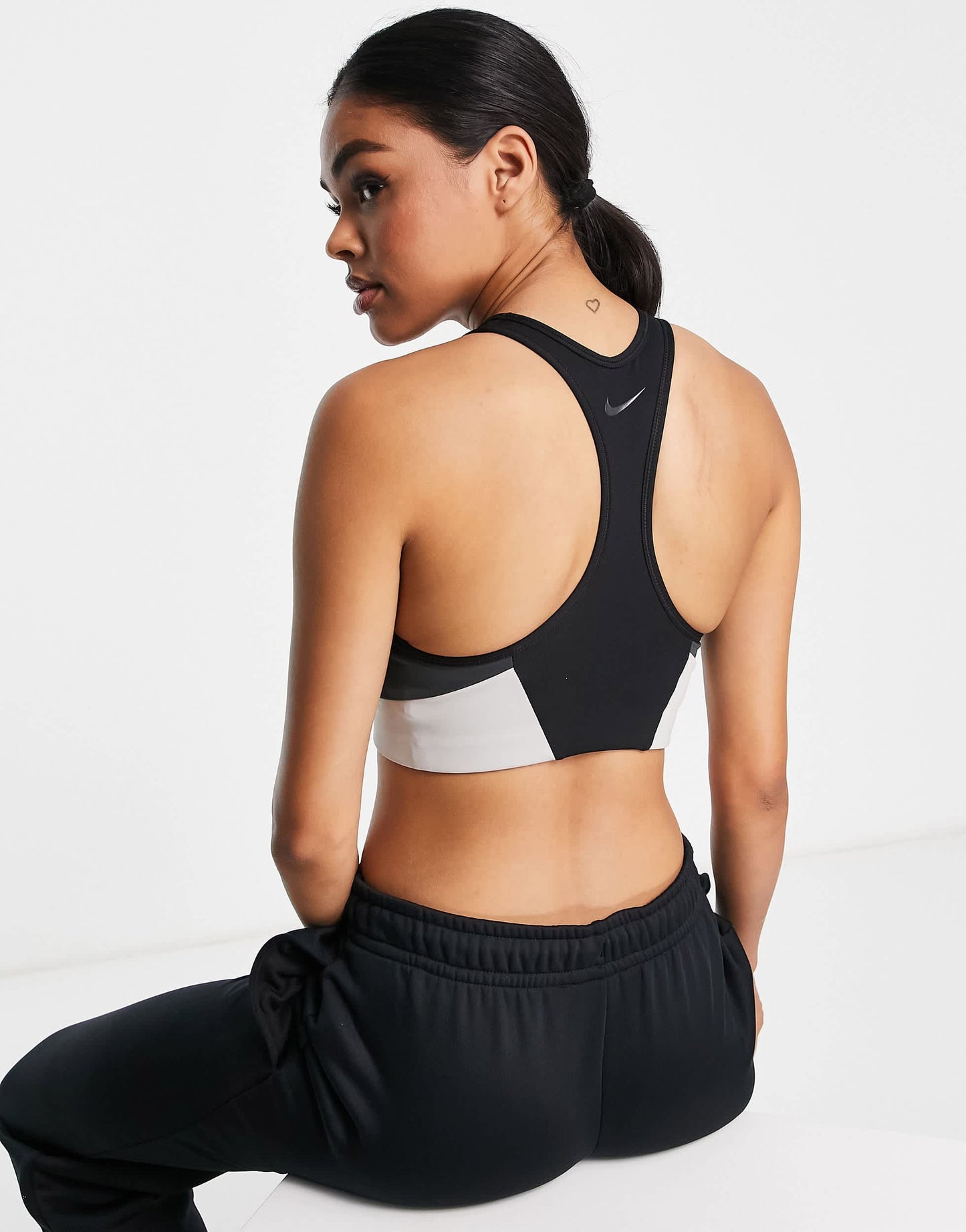 Nike One Training colourblock logo medium support sports bra in black