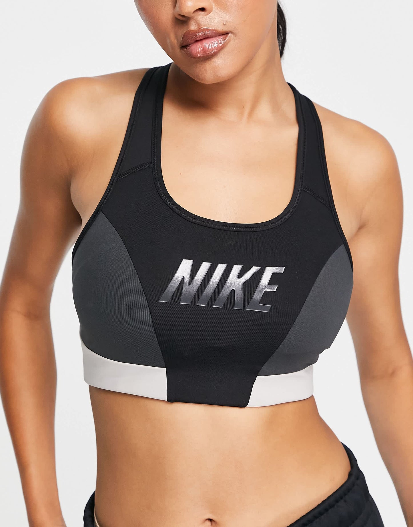 Nike One Training colourblock logo medium support sports bra in black