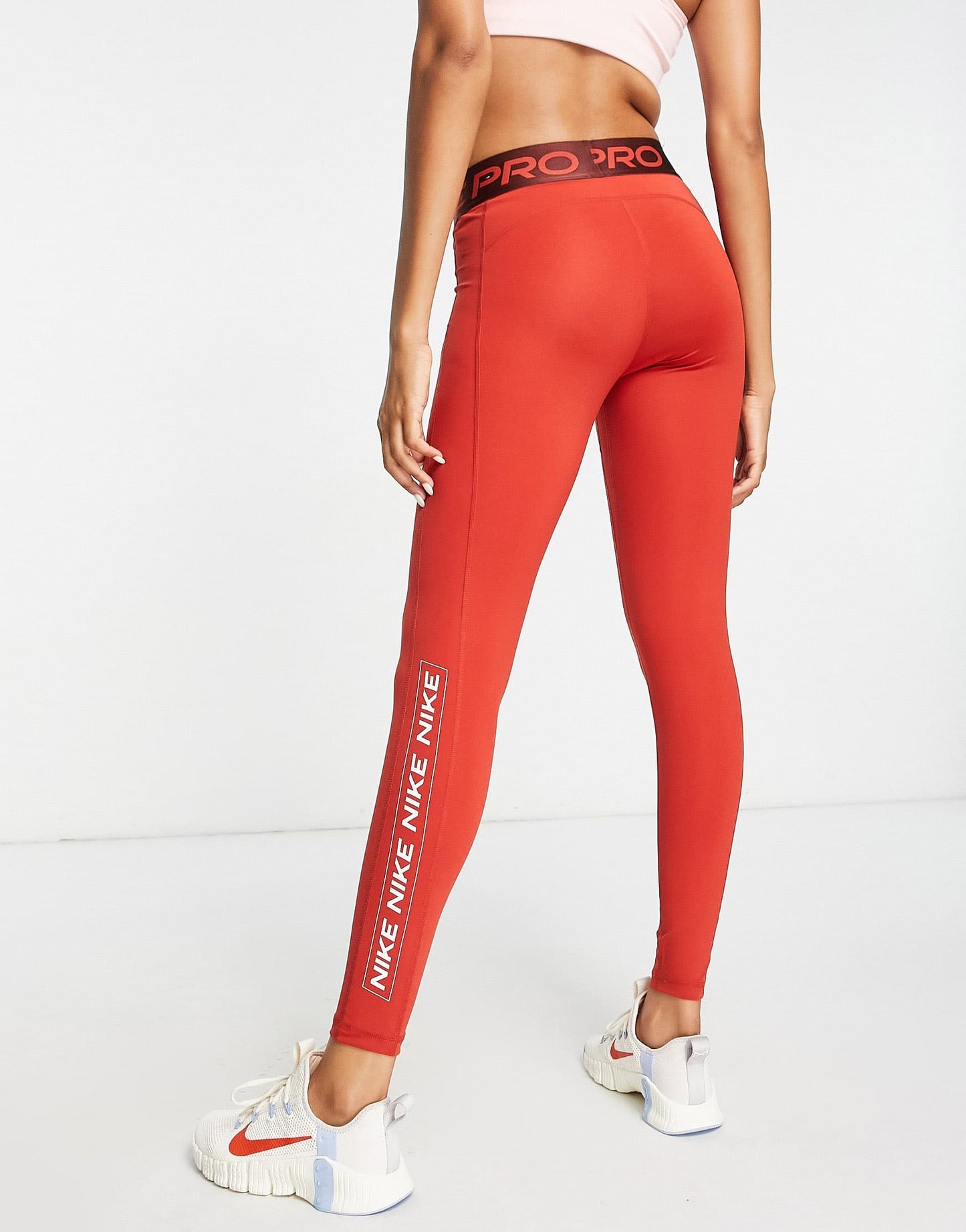 Nike Pro Training Dri-FIT graphic mid rise leggings in red