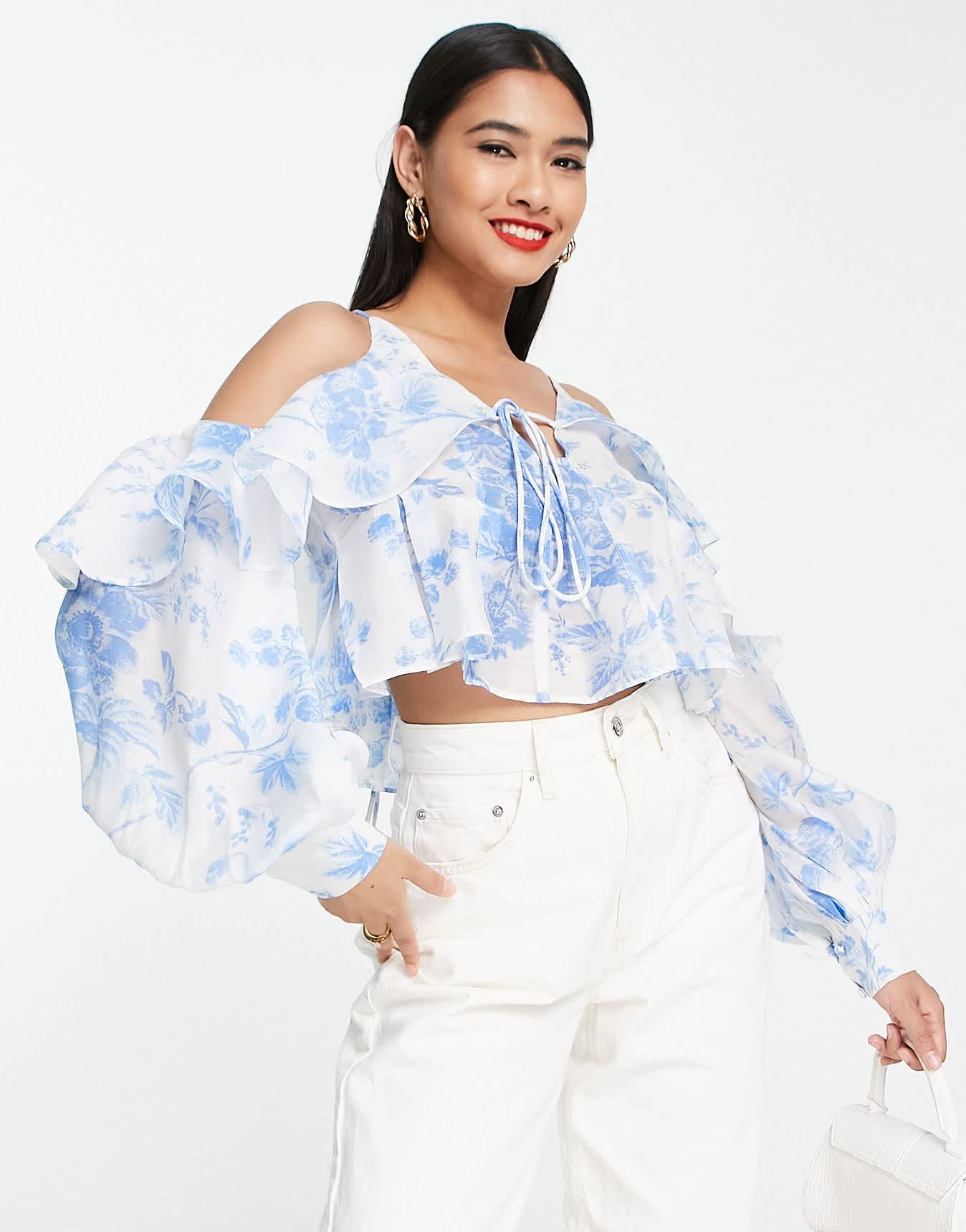 ASOS DESIGN ruffle blouse with lace up back in blue floral