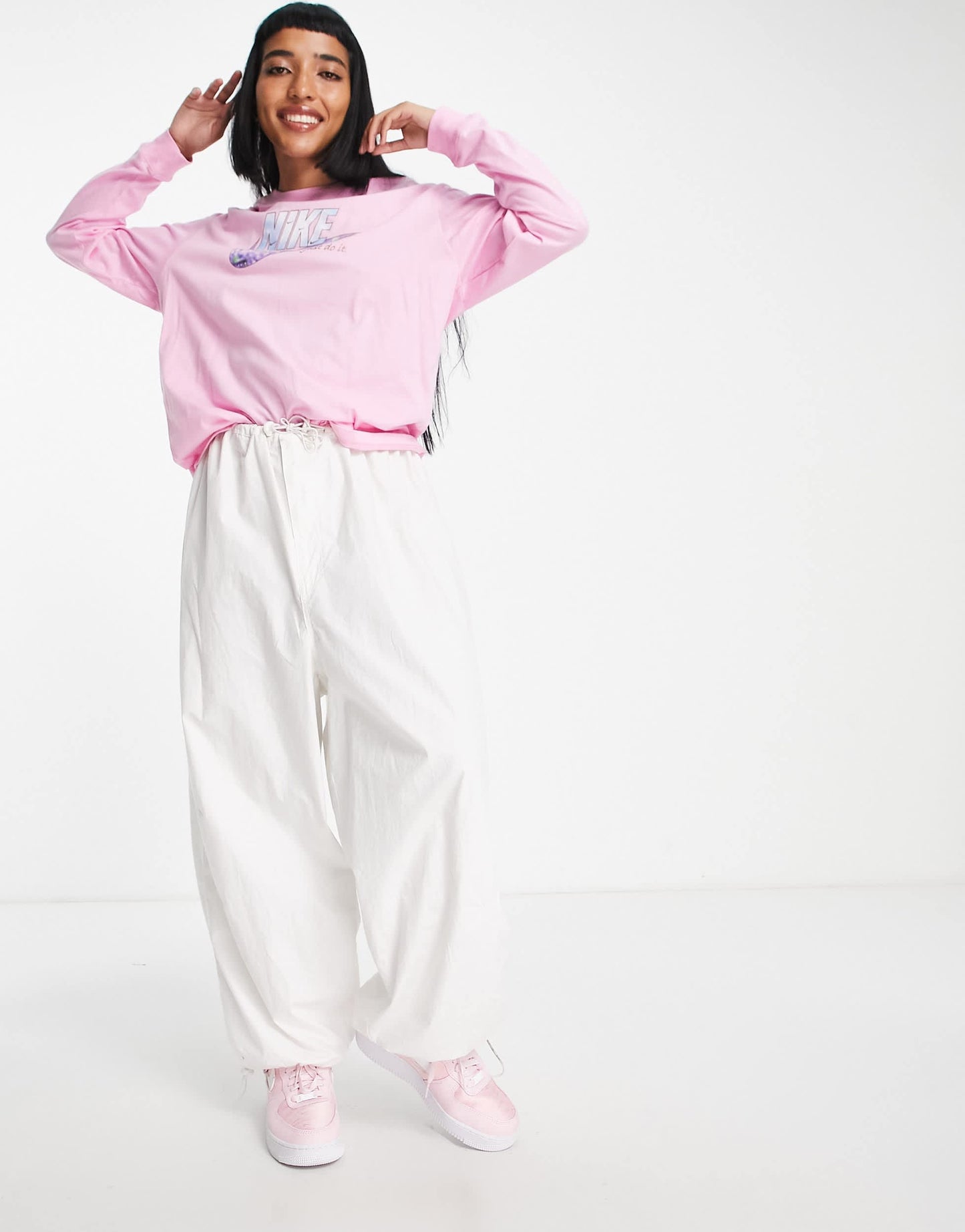 Nike sparkle swoosh graphic logo long sleeve t-shirt in pink