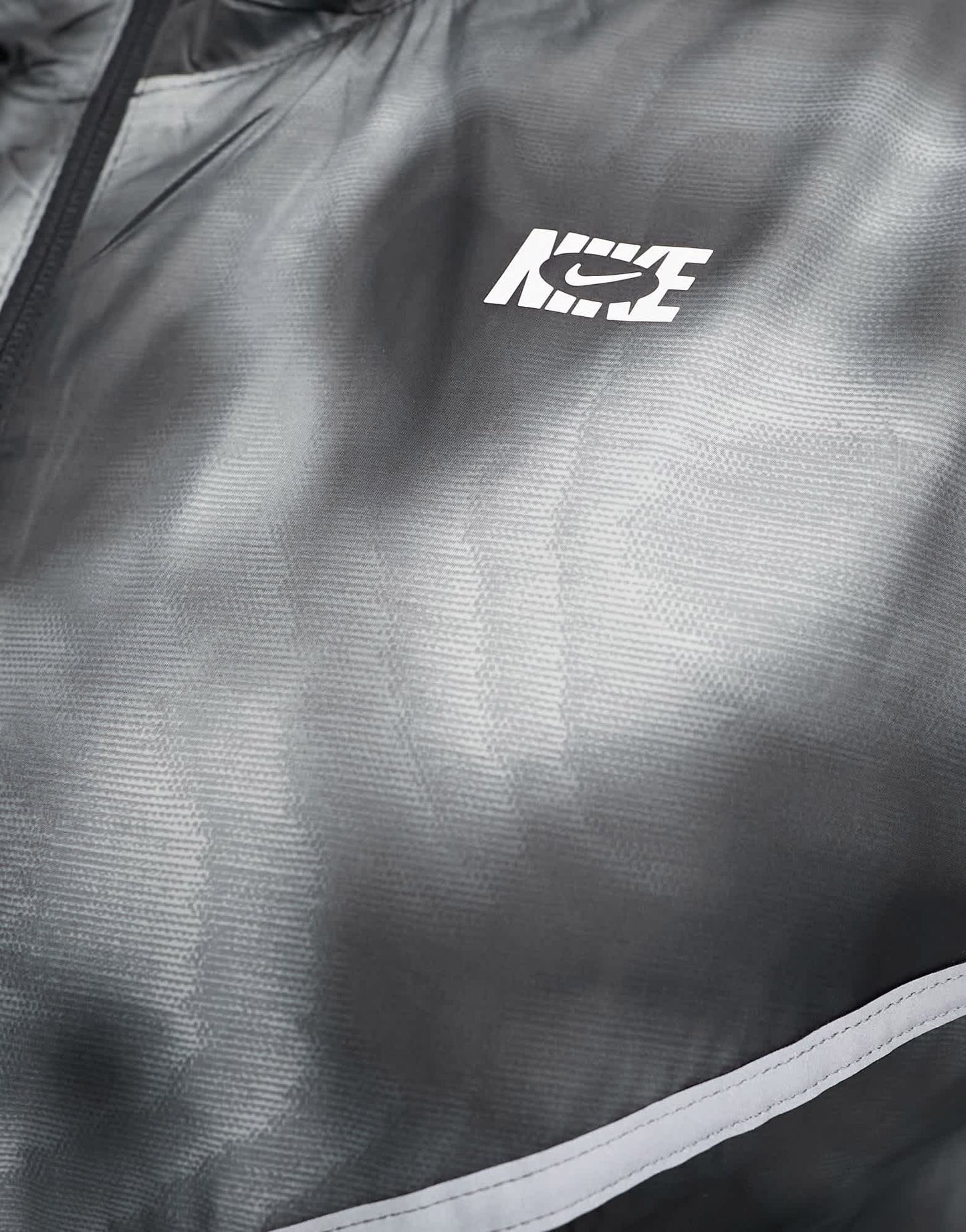 Nike Running Icon Clash Plus Repel woven all over print jacket in black