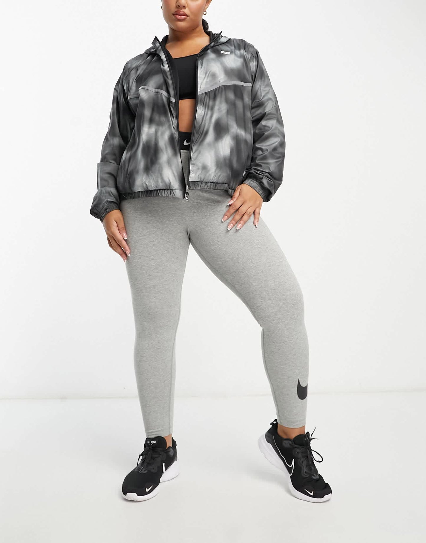 Nike Running Icon Clash Plus Repel woven all over print jacket in black