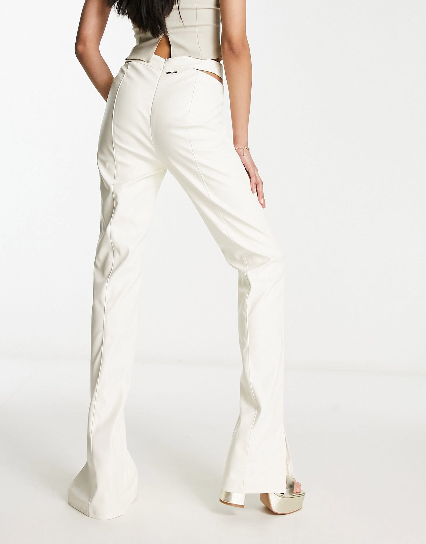 The Couture Club high waisted cut out trousers in cream