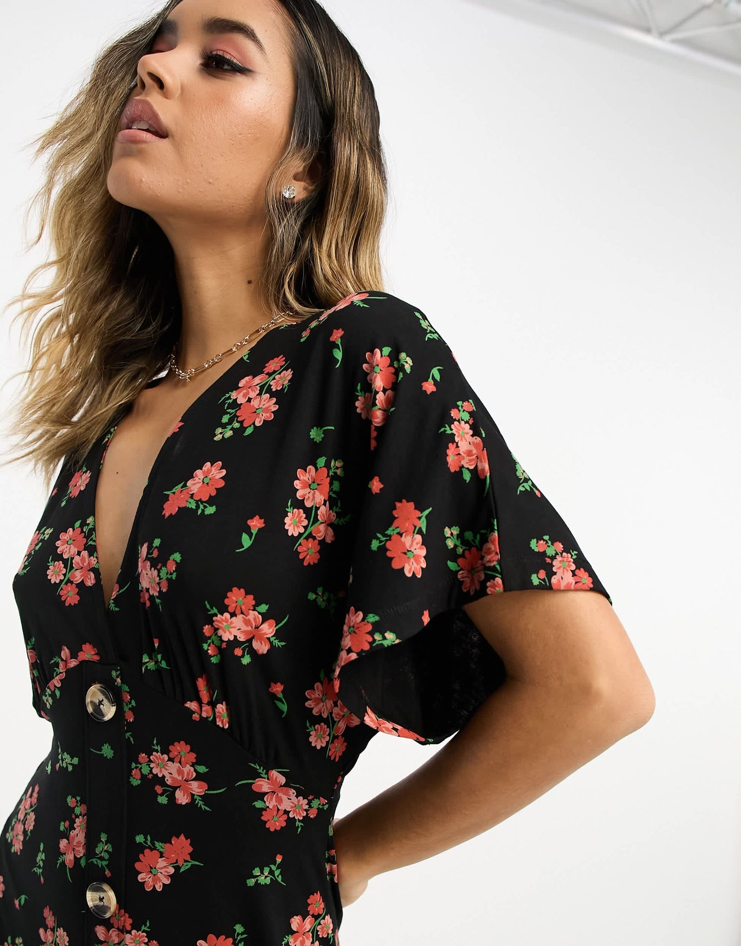 ASOS DESIGN flutter sleeve midi tea dress with buttons in black floral print