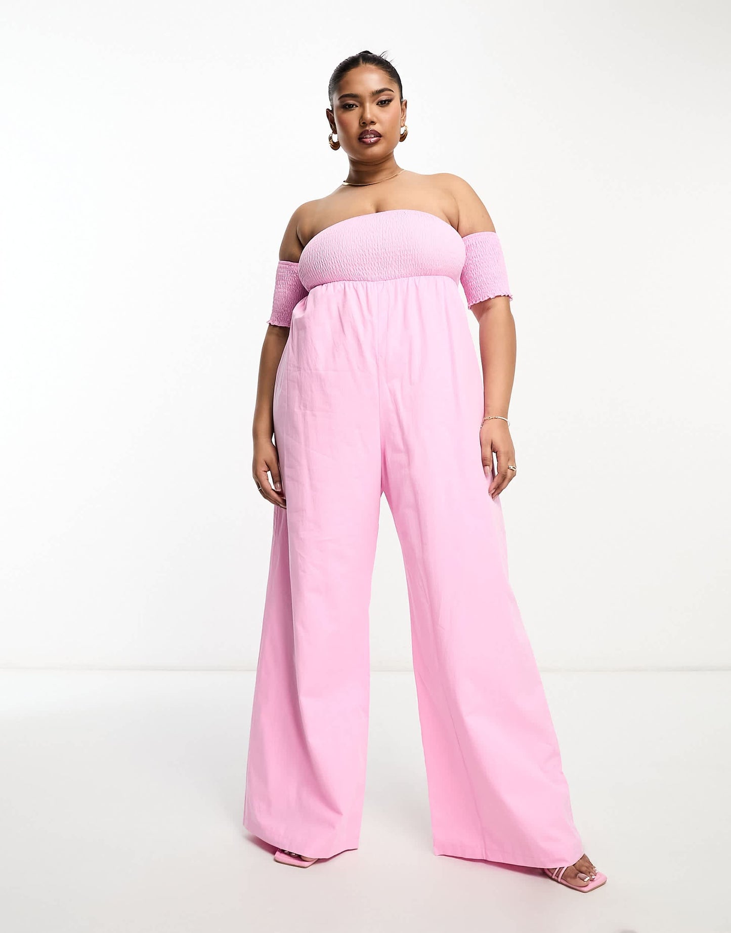 The Frolic Plus shirred off shoulder wide leg jumpsuit in pink