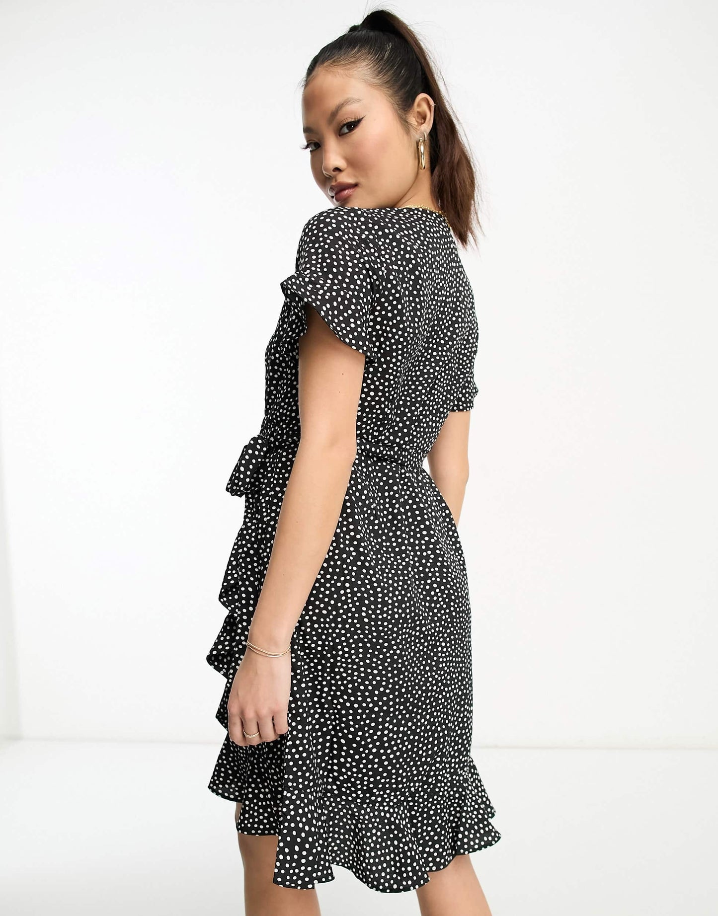 Vero Moda Petite wrap mini dress in black spot print