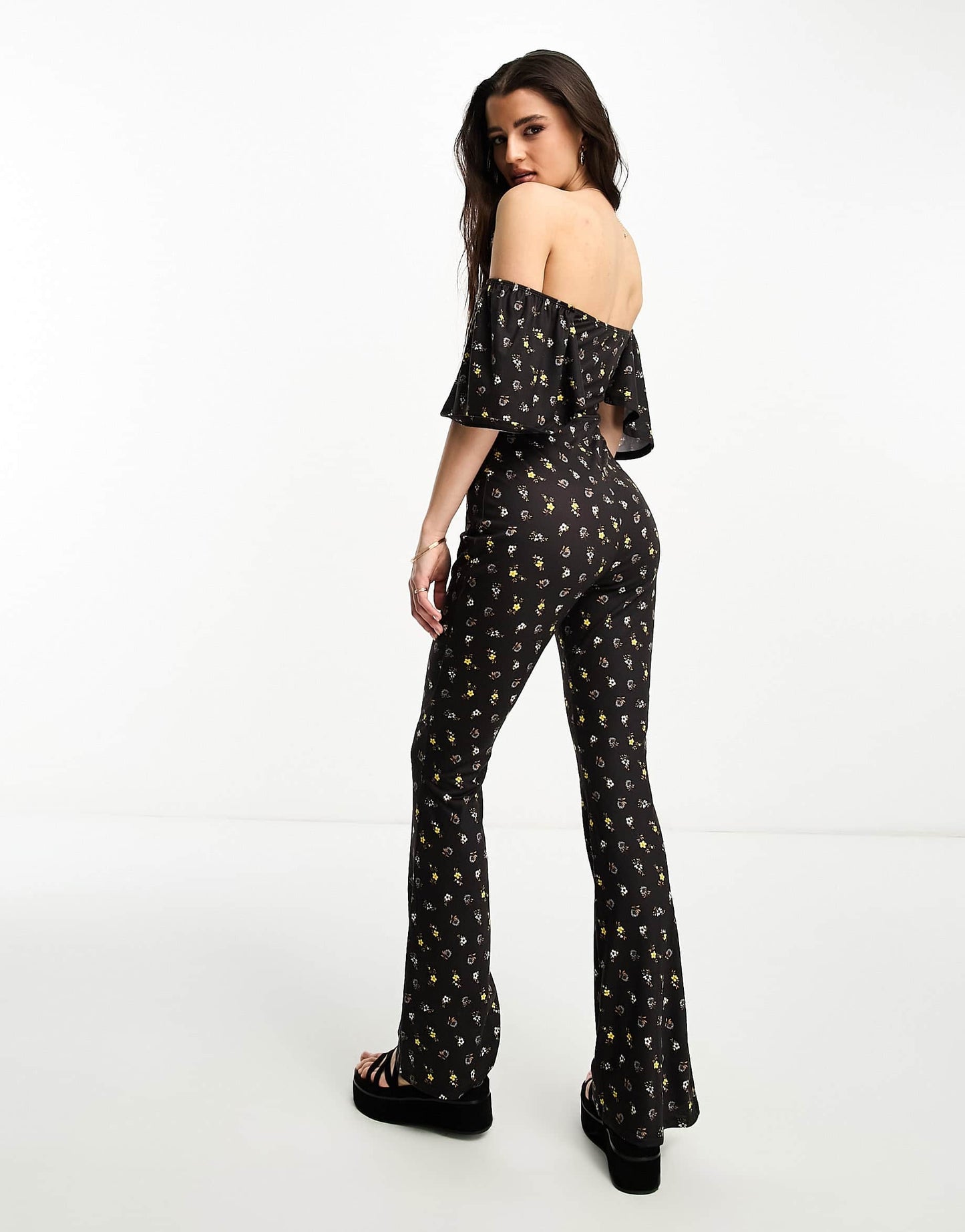 ASOS DESIGN jersey fluted sleeve jumpsuit with flare leg in ditsy floral