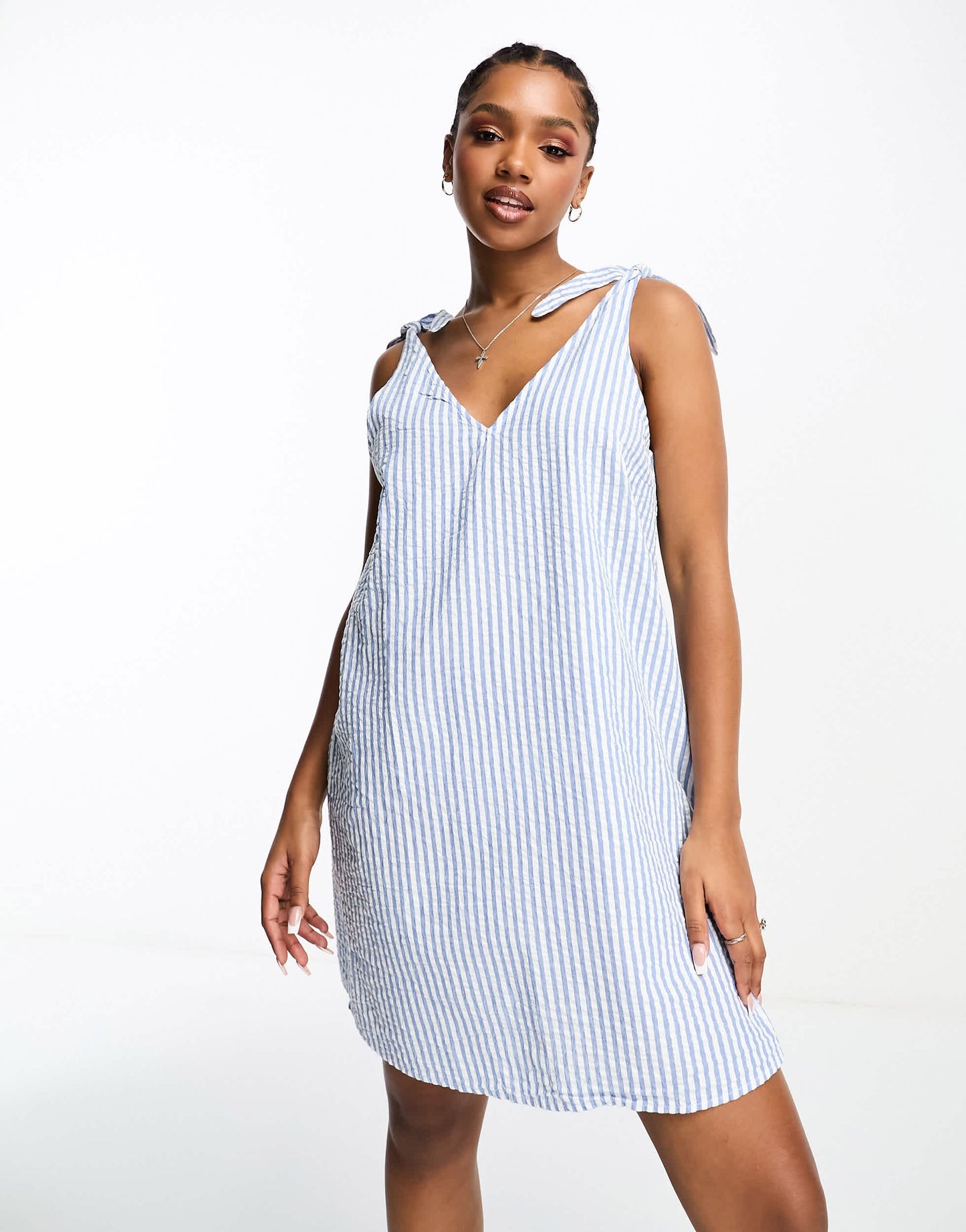 Monki seersucker bow tie strap mini dress with side pockets in blue and white stripe