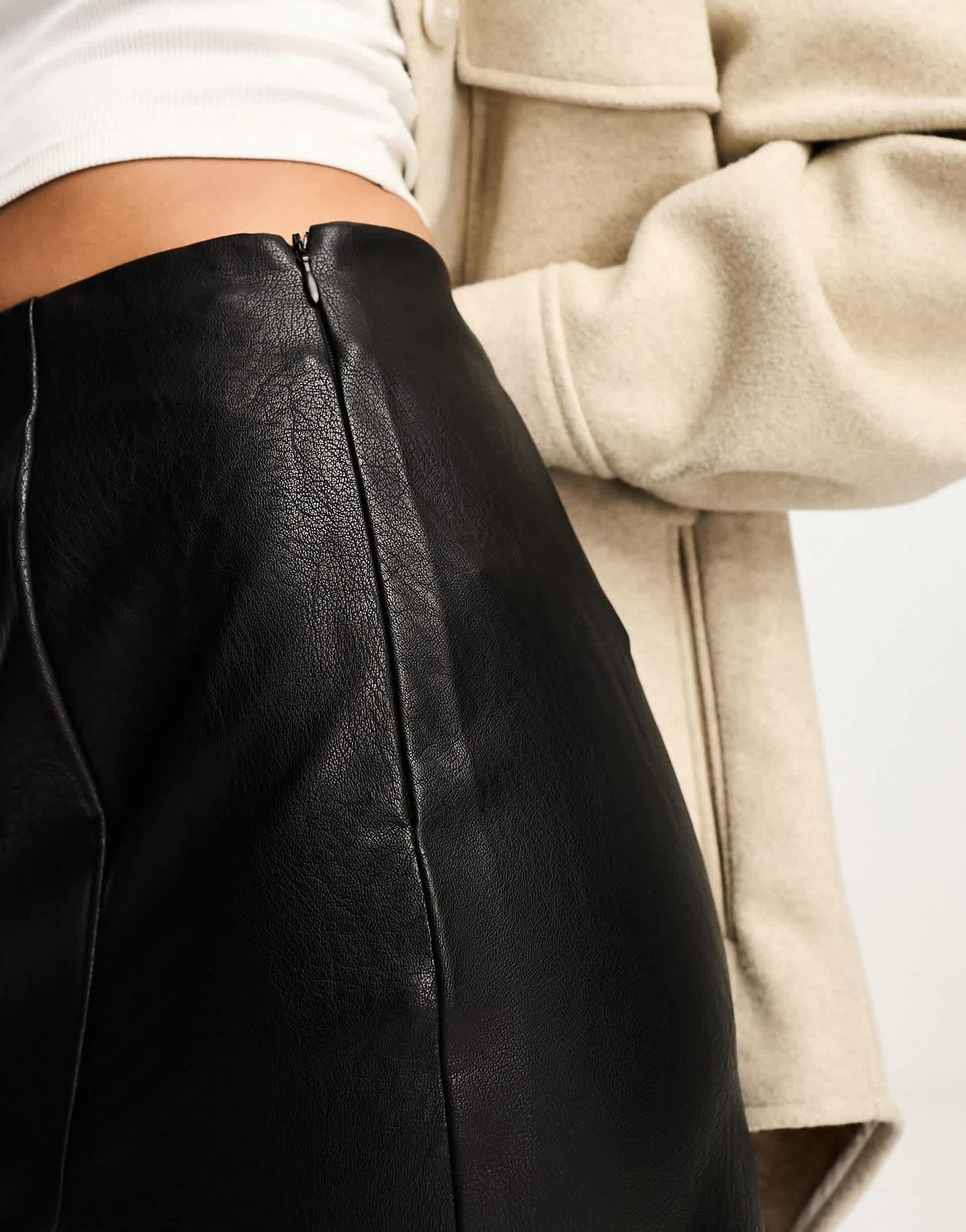 Stradivarius faux leather mini skirt with split hem in black