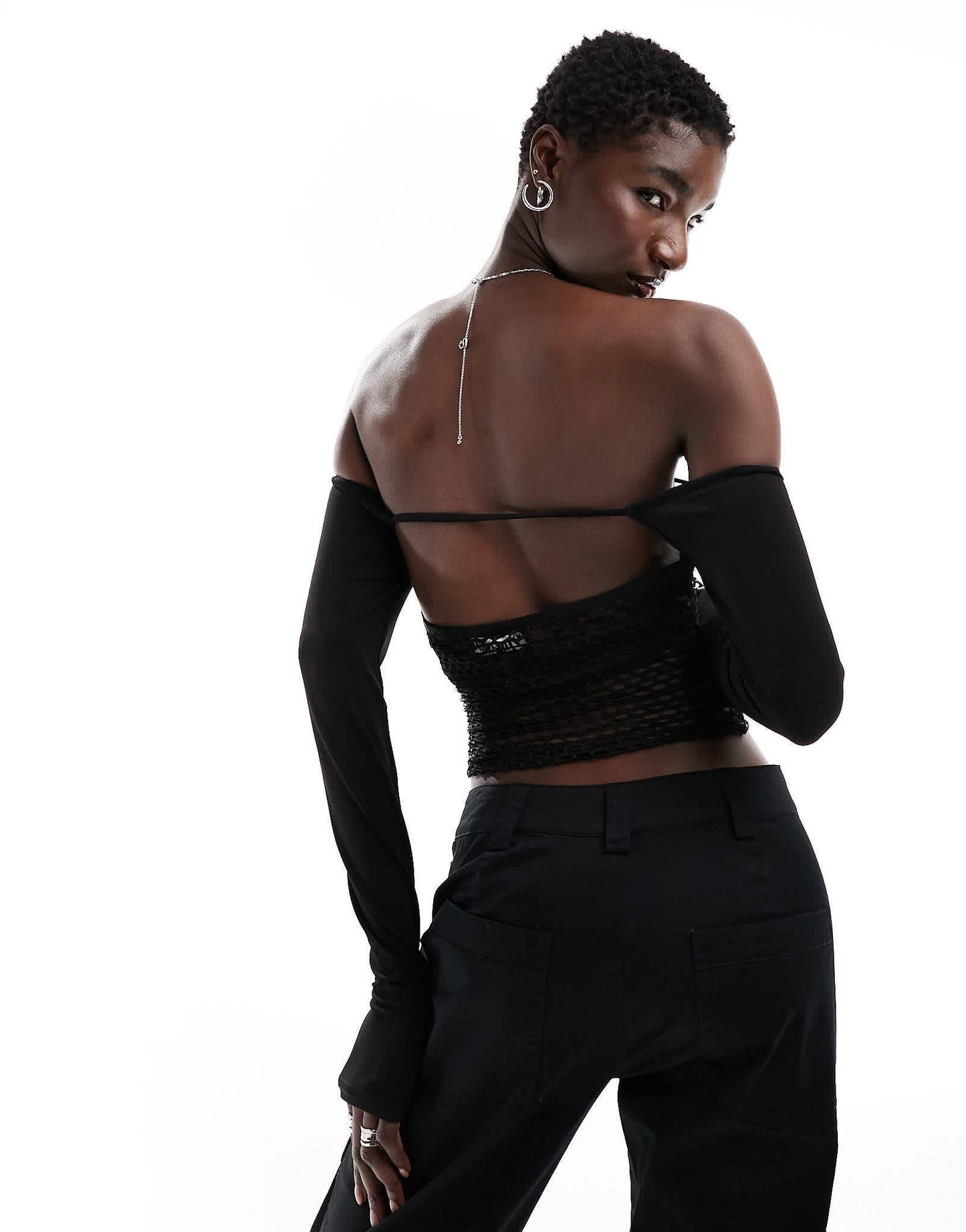 The Kript fishnet long sleeve cut out crop top in black