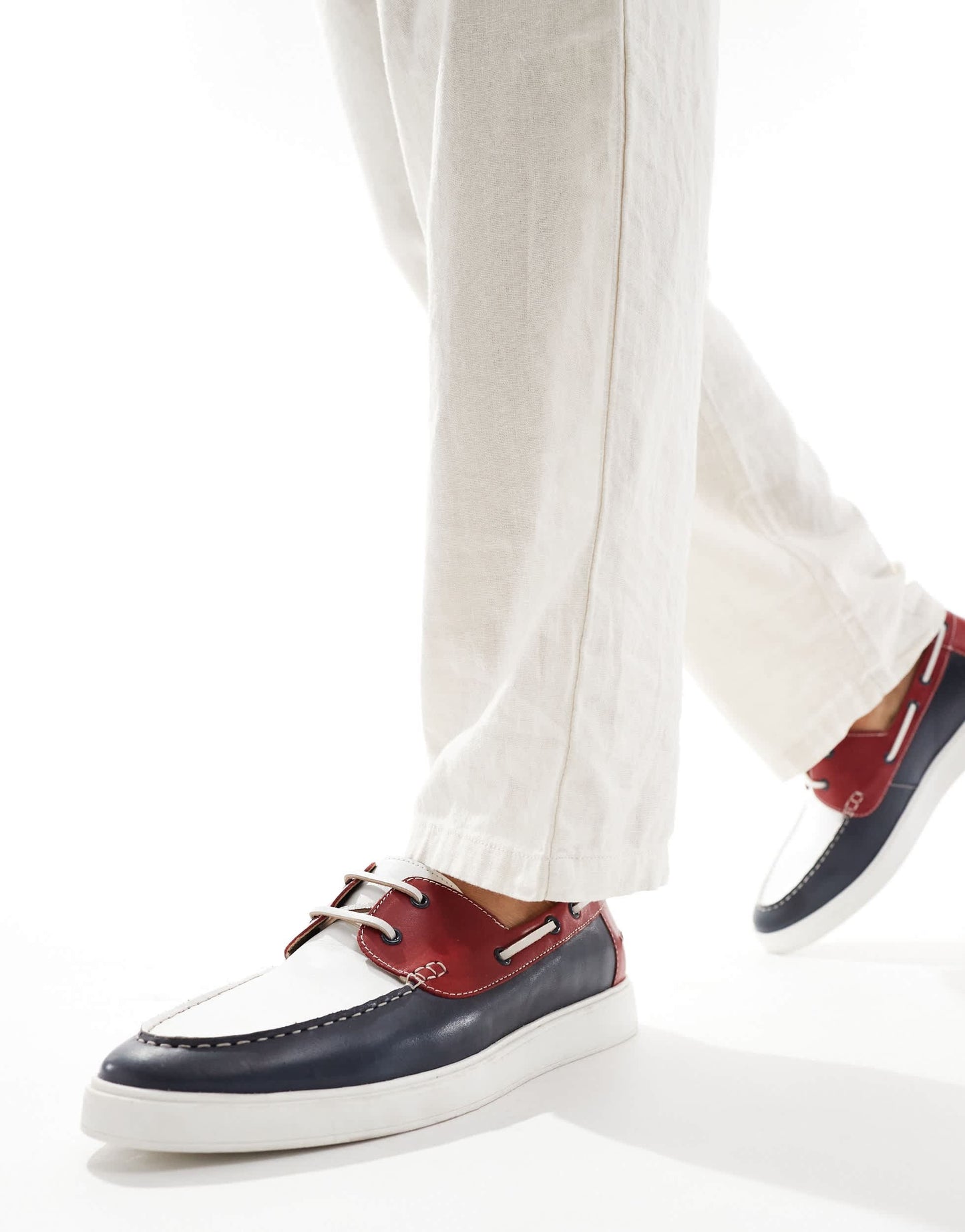 ASOS DESIGN lace up boat shoes in navy suede with red and white details