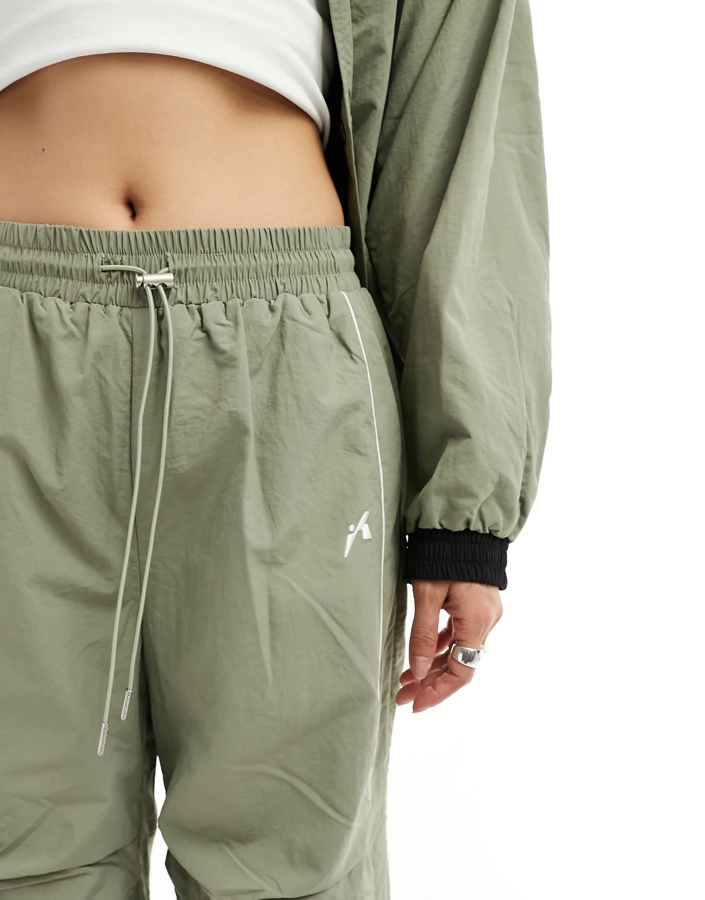 The Kript wide leg tech trousers with contrast detail co-ord in sage and black