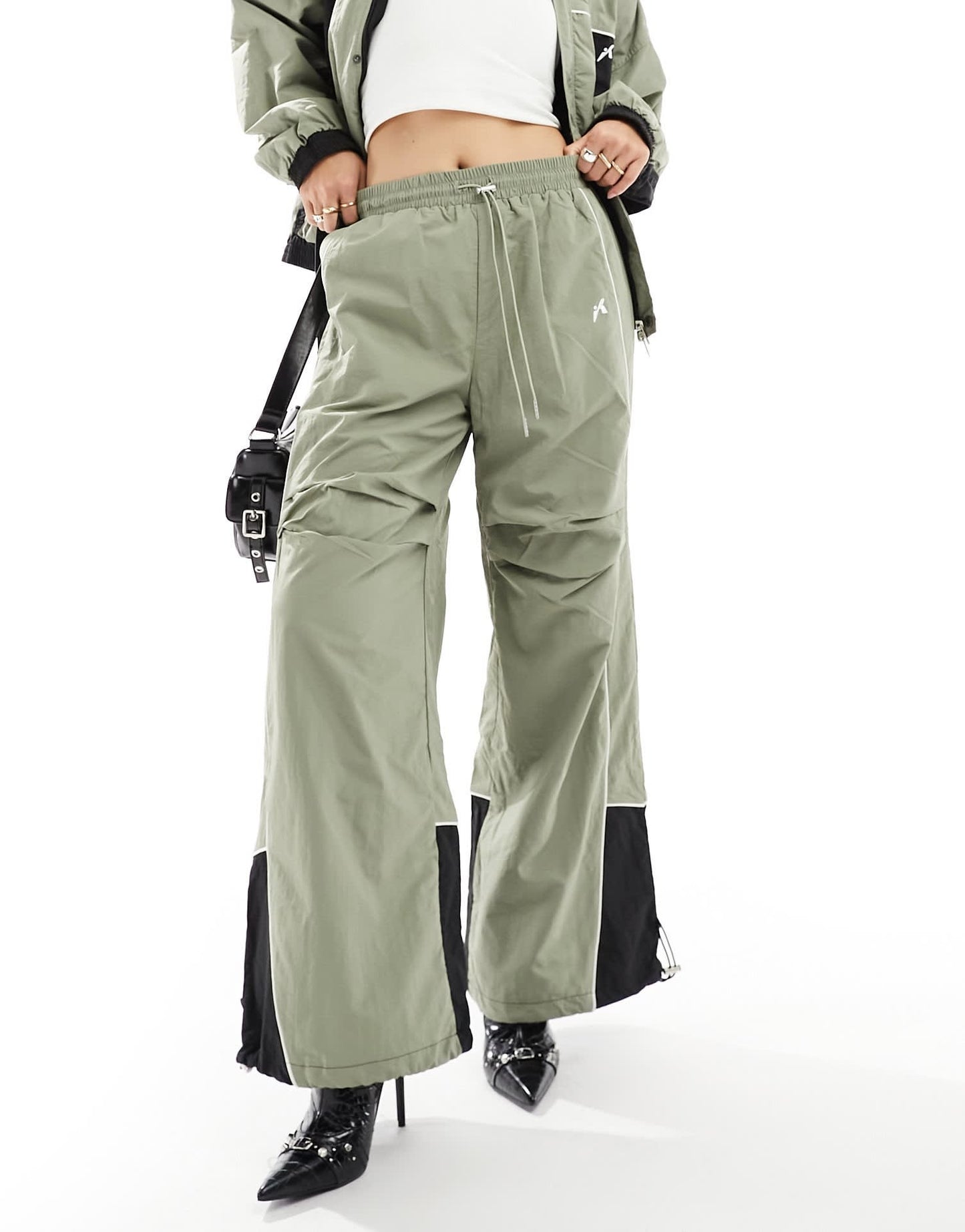 The Kript wide leg tech trousers with contrast detail co-ord in sage and black