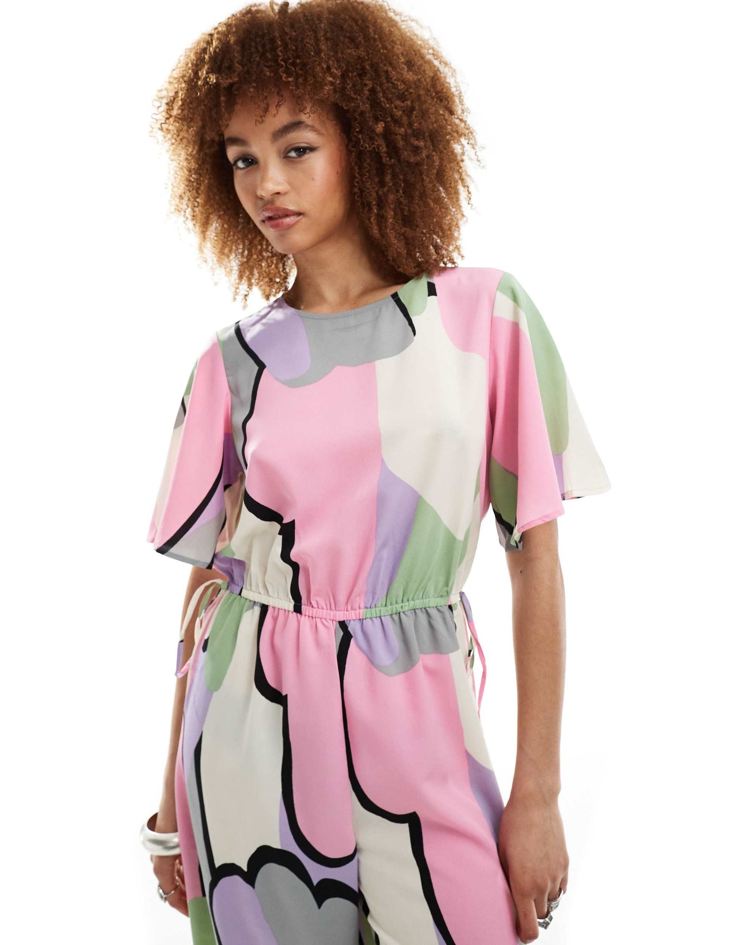 Monki jumpsuit with tie waist detail in multi cloud print