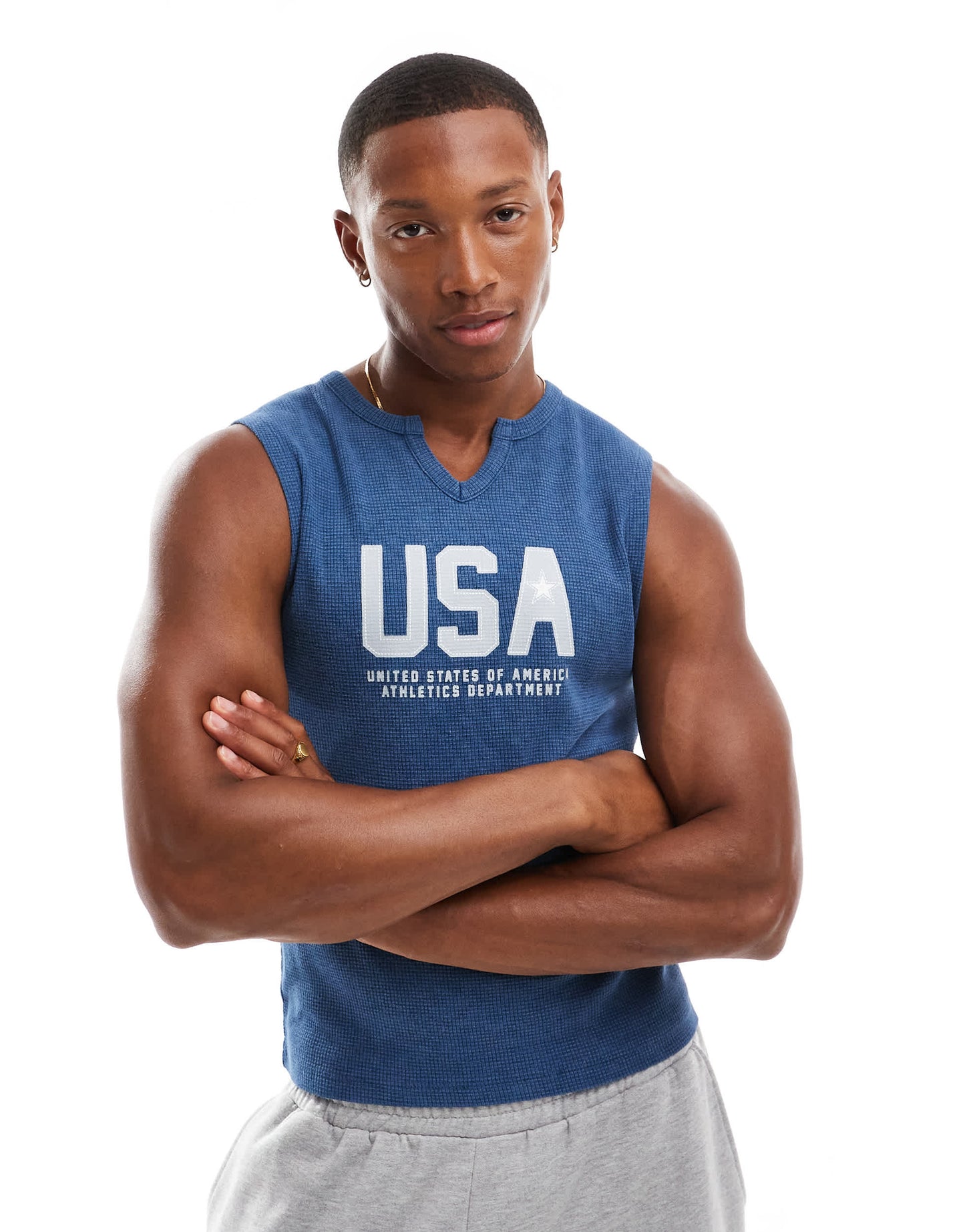 ASOS DESIGN muscle fit tank vest in blue with cut neck and USA chest print