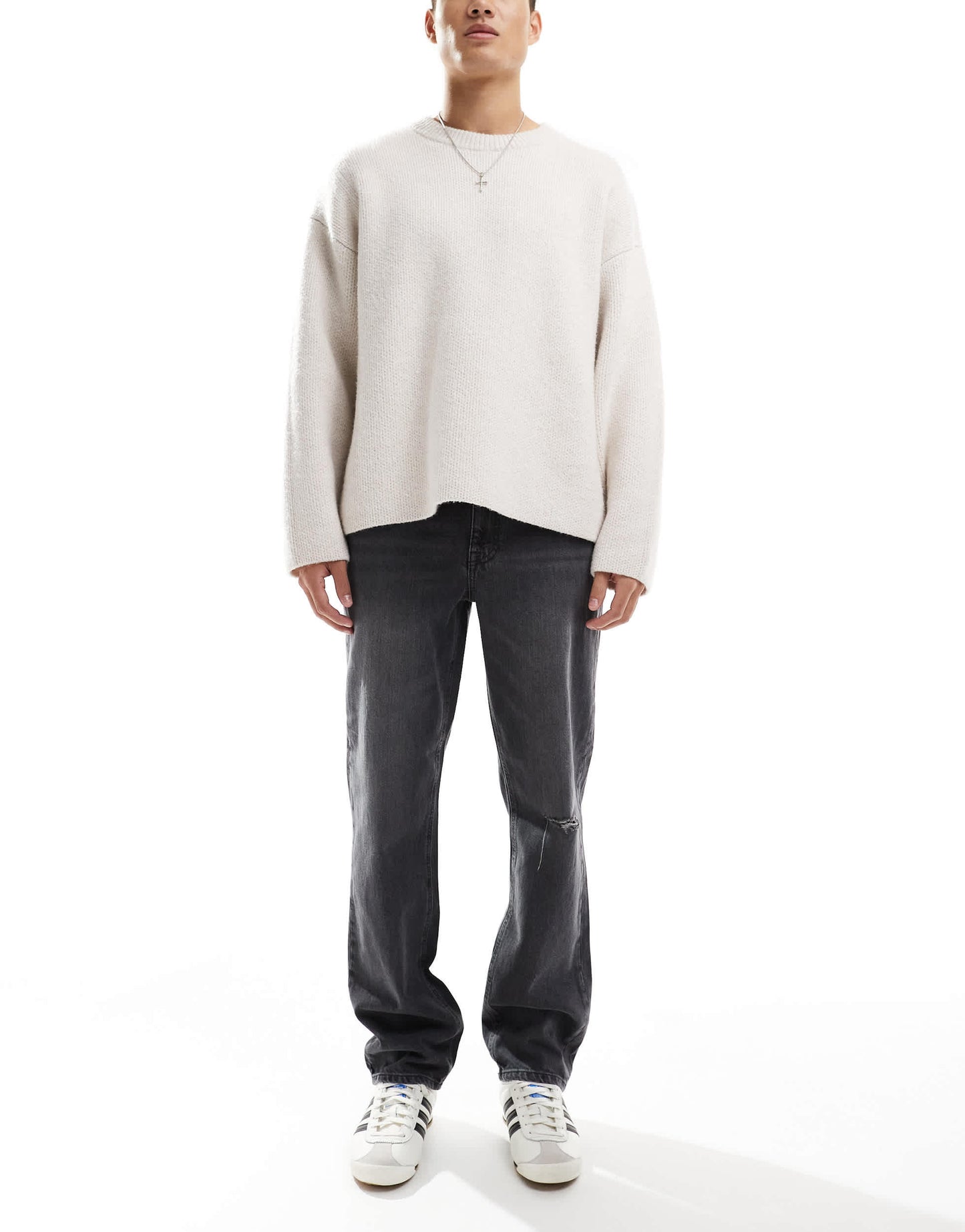 ASOS DESIGN straight leg jeans with rips in washed black