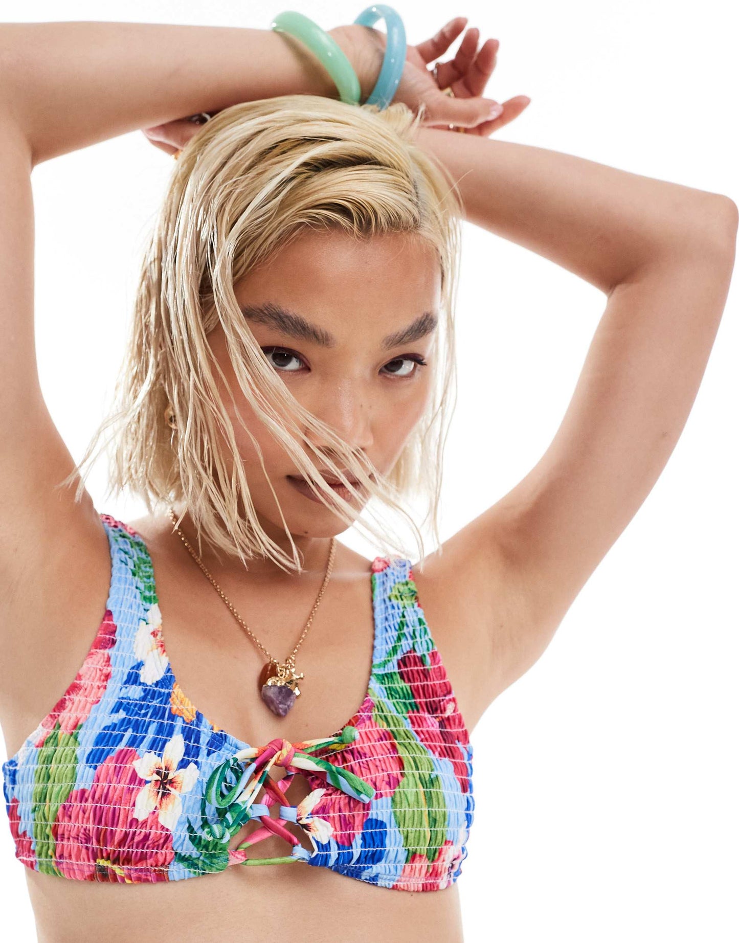 Reclaimed Vintage crinkle bikini top with crossover tie front in blue floral print