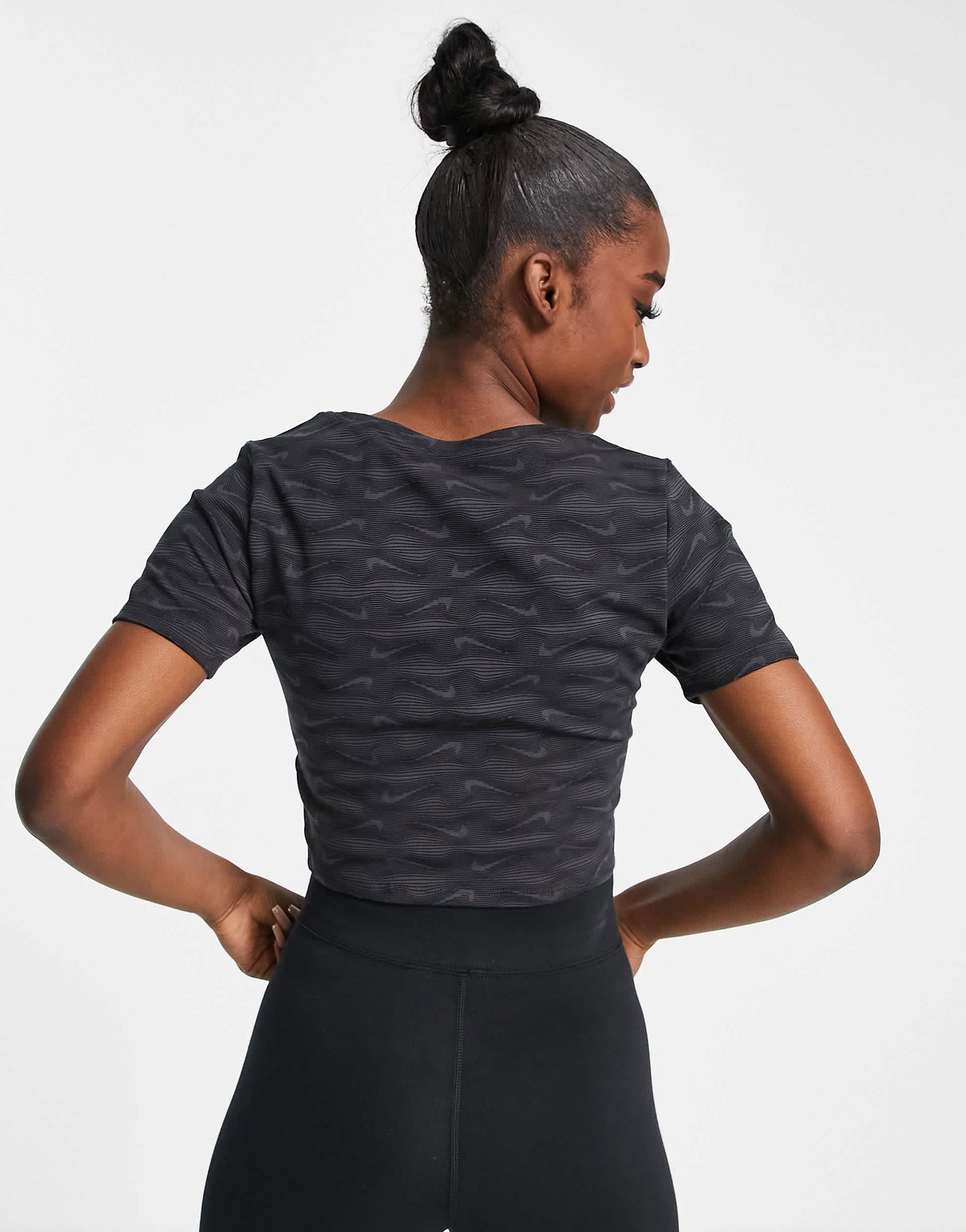 Nike all over printed logo cropped t-shirt with scoop neck in black