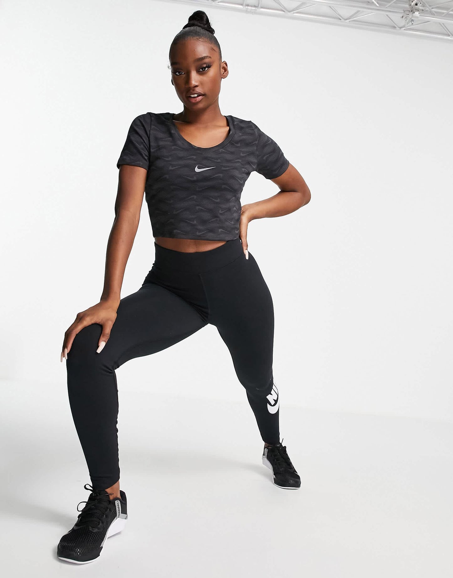 Nike all over printed logo cropped t-shirt with scoop neck in black