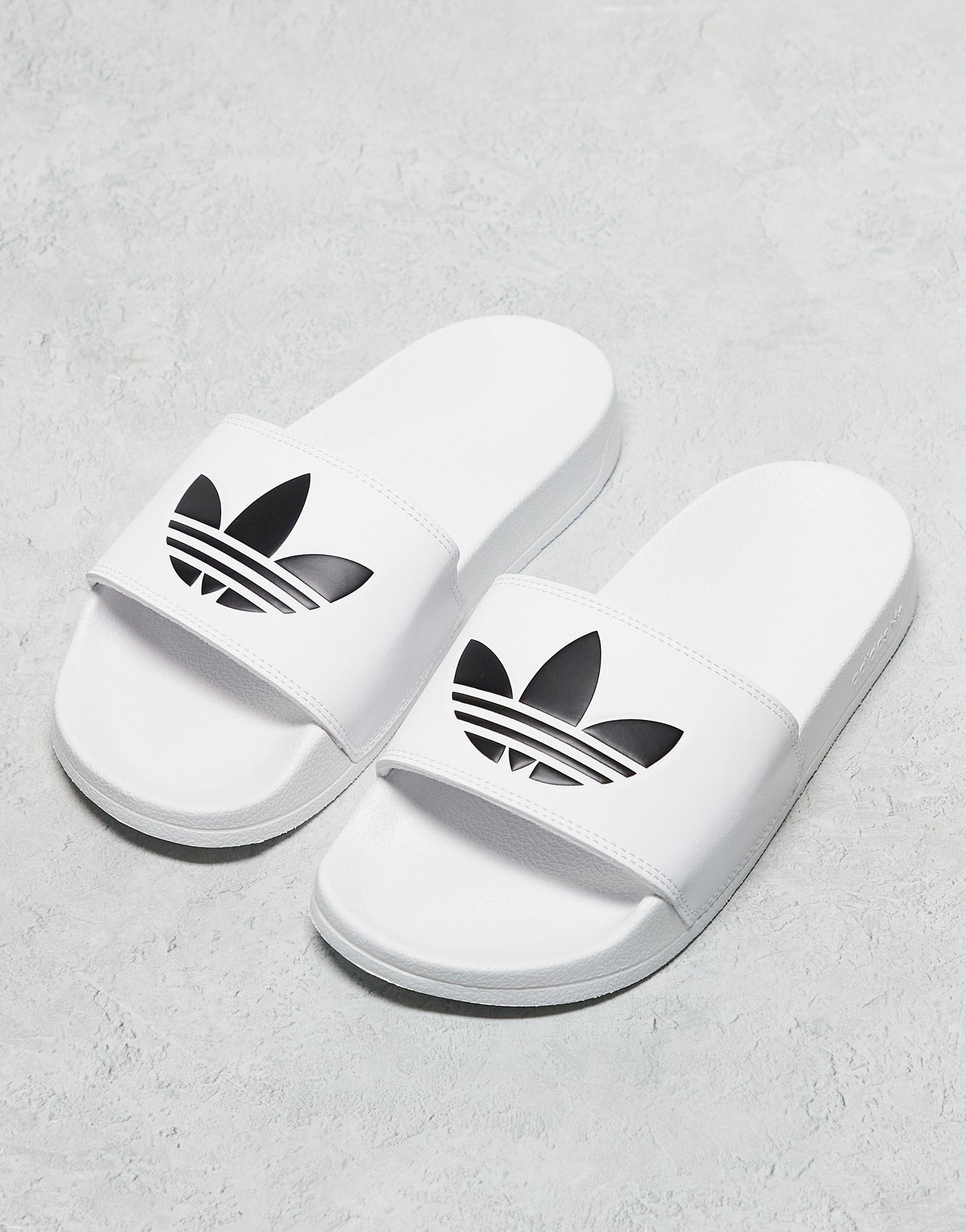 adidas Originals adilette Lite sliders in white