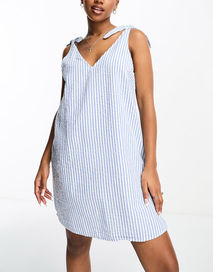 Monki seersucker bow tie strap mini dress with side pockets in blue and white stripe