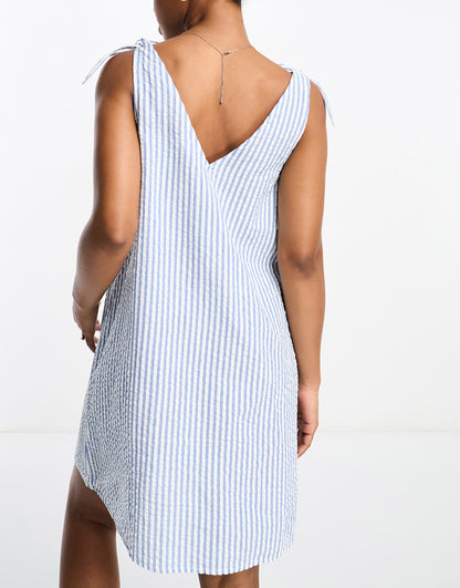 Monki seersucker bow tie strap mini dress with side pockets in blue and white stripe