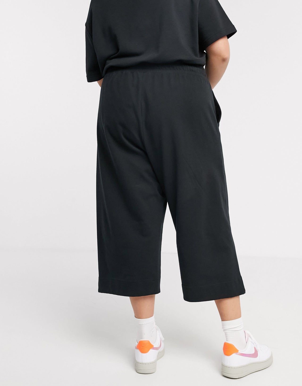 Nike Plus premium tonal cropped wide leg joggers in black