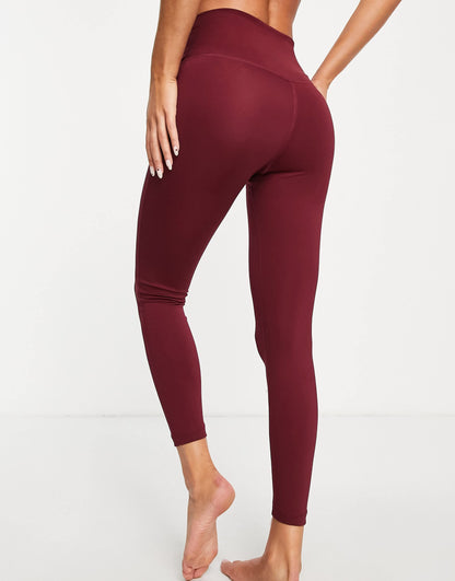 Nike Yoga Dri-FIT lurex tape 7/8 high-waisted leggings in burgundy