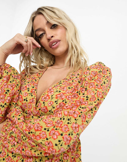 ASOS DESIGN Maternity v neck volume sleeve top with peplum hem in mustard print