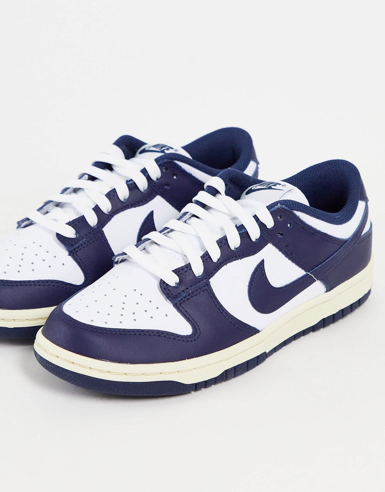 Nike Dunk Low trainers in white/midnight navy