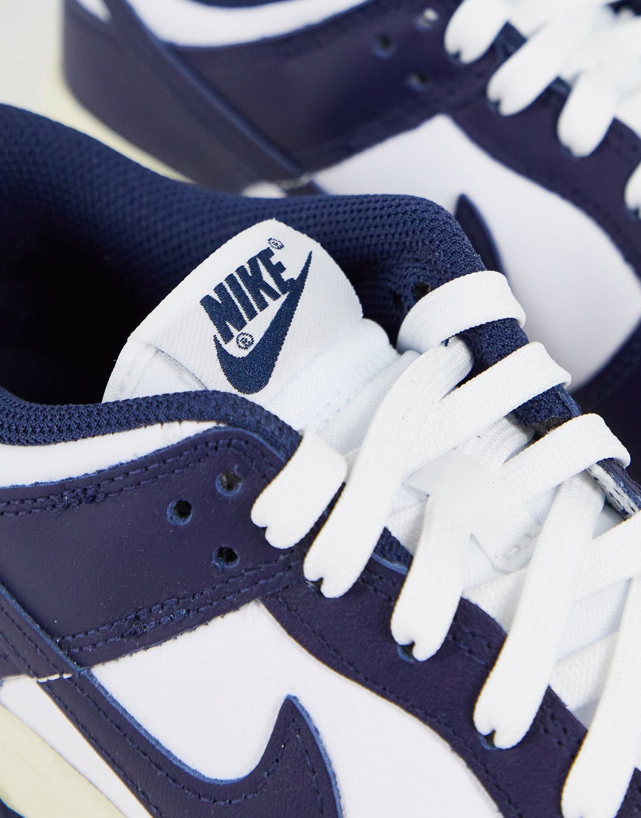 Nike Dunk Low trainers in white/midnight navy
