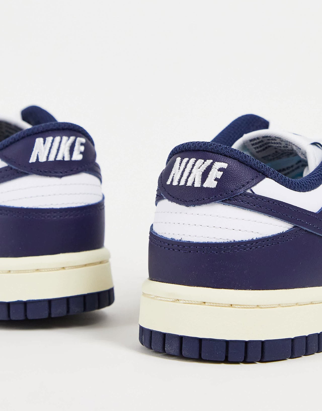 Nike Dunk Low trainers in white/midnight navy