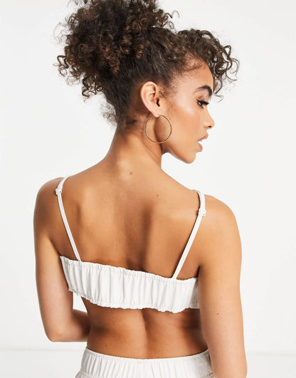 Nike Swoosh cropped ruched backstrap cami top in off white
