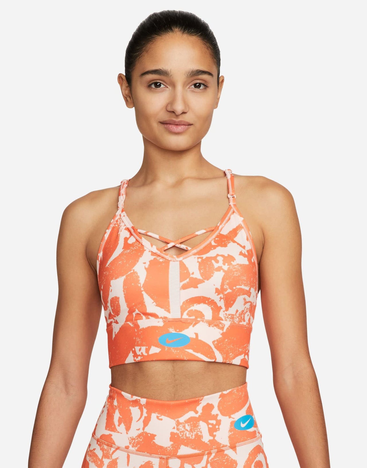 Nike Training Dri-FIT Indy Icon Clash all over print bra in orange