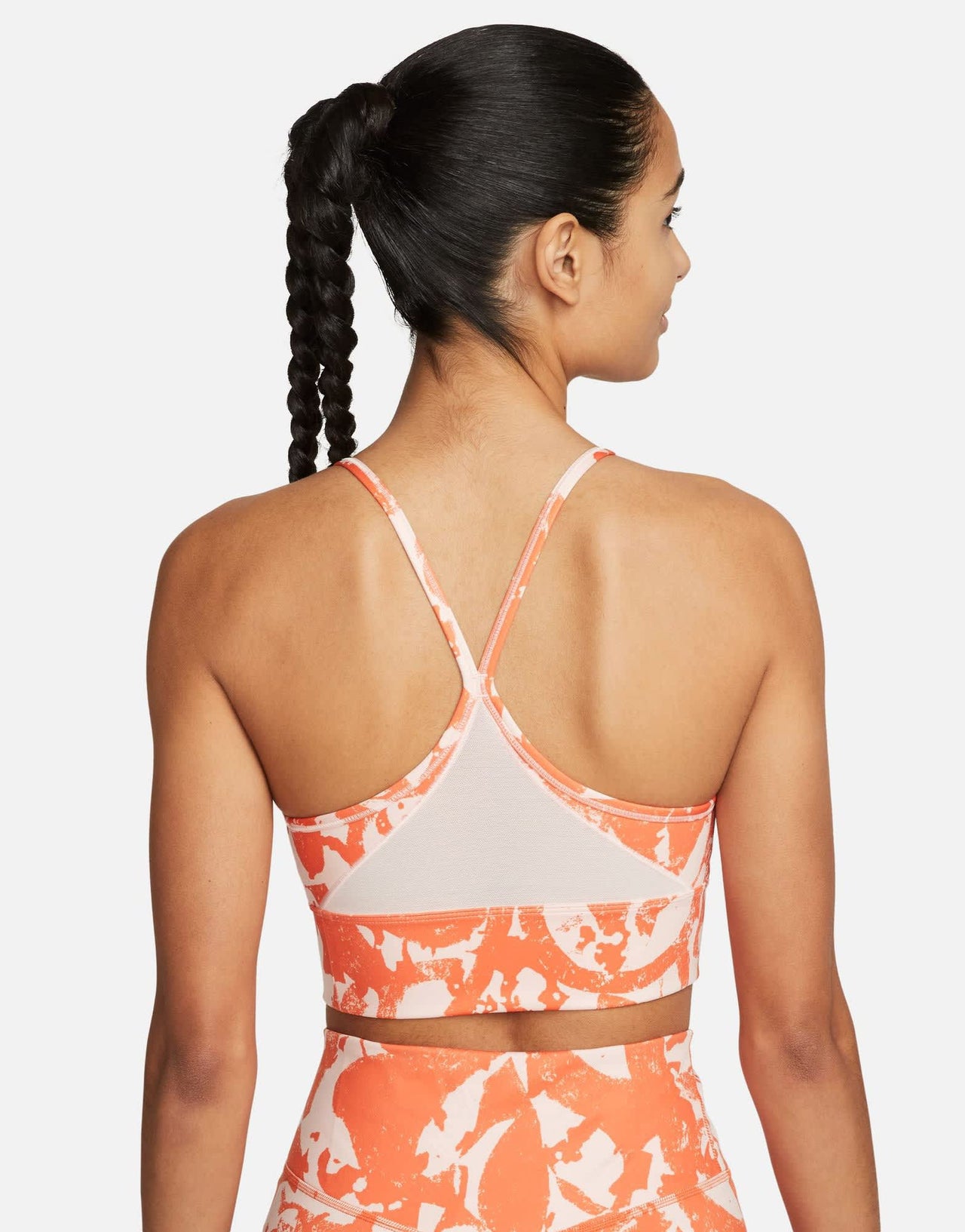 Nike Training Dri-FIT Indy Icon Clash all over print bra in orange