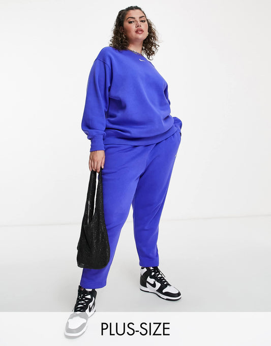 Nike Plus mini swoosh curved high rise joggers in lapis blue