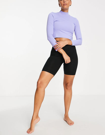 Nike Yoga Luxe Dri-FIT cropped long sleeve top in lilac