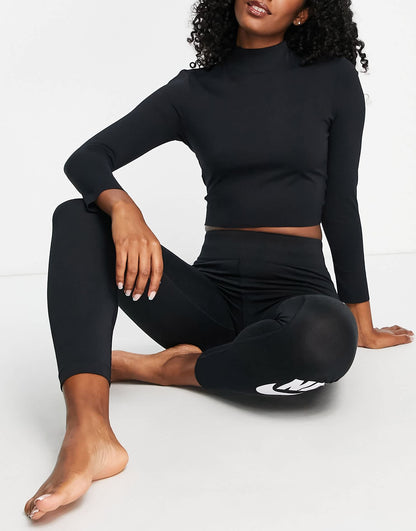 Nike Yoga Luxe Dri-FIT cropped long sleeve top in black