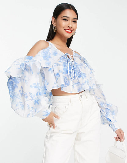 ASOS DESIGN ruffle blouse with lace up back in blue floral
