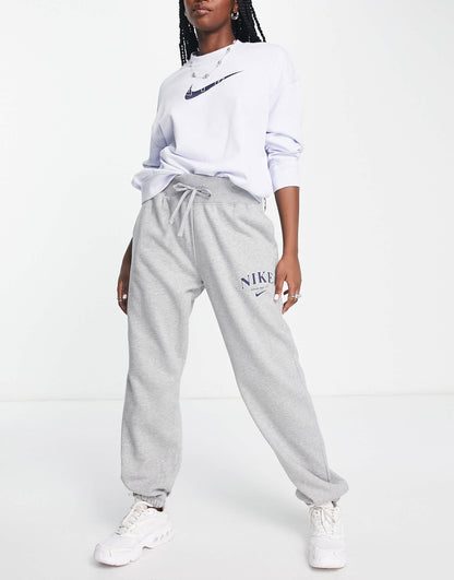 Nike Unisex retro athletics fleece joggers in grey heather and navy