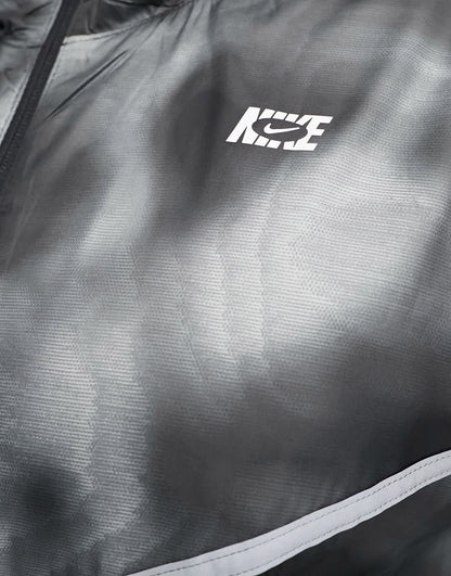 Nike Running Icon Clash Plus Repel woven all over print jacket in black